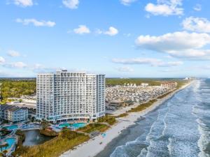 an aerial view of a resort and the beach at Direct OCEANFRONT- King Bedroom- AMAZING VIEWS/Pools/Hot Tubs/Beach Access/Golf in Myrtle Beach