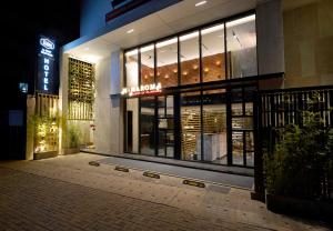 a store front of a building at night at Aiden by Best Western Hennur in Bangalore