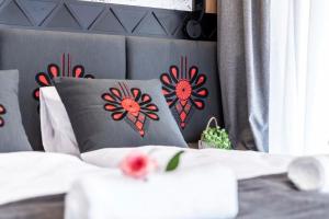 Łóżko lub łóżka w pokoju w obiekcie Modrzejewska Residence Zakopane