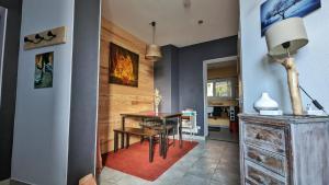 a dining room with a table and a dining room at chambre condamine spa in Millau