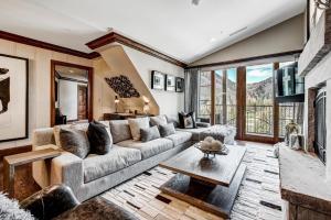 a living room with a couch and a table at Ritz 2Br R614 in Vail