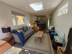 a living room with a couch and a table at Walpole BACK House sleeps 6-8 in Margate +29 photos