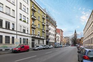 a city street with cars parked on the side of the road at PrimoPiano - Casoretto in Milan