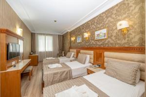 Кровать или кровати в номере Dalan Hotel -Old City istanbul