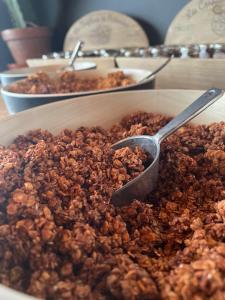 a bowl of nuts with a spoon in it at LOGIS HOTEL - La Petite Rade in Le Havre