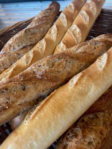 a group of breadsticks sitting on a basket at LOGIS HOTEL - La Petite Rade in Le Havre