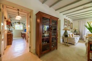 a living room with a large wooden cabinet and a couch at DIAMOND HAVEN in MALINDI in Malindi