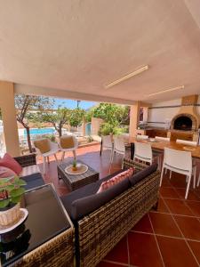 a living room with a couch and a fireplace at Villa Bon Dia in Calpe