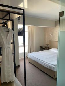 Кровать или кровати в номере Boutique Hotel Dacha Lanzheron