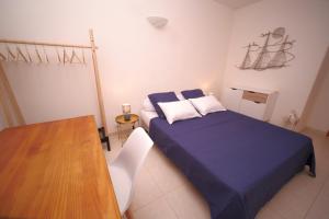 Voodi või voodid majutusasutuse Grand F2 Bastia Centre Port de Toga, Terrasse Vue Mer toas
