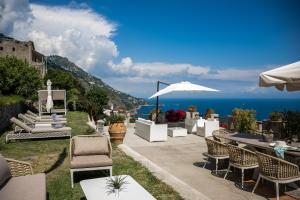 a patio with a view of the ocean at Villa Marilu Praiano in Praiano