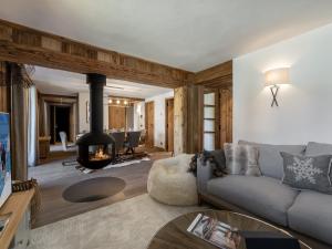 a living room with a couch and a fireplace at Appartement Val-d'Isère, 4 pièces, 8 personnes - FR-1-567-74 in Val-d'Isère