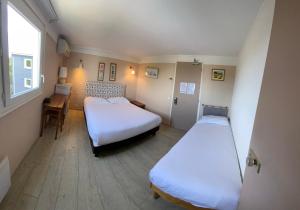 Ένα ή περισσότερα κρεβάτια σε δωμάτιο στο Contact Hotel LE SUD Montpellier Aéroport Parc Expo Arena