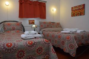 Postelja oz. postelje v sobi nastanitve Carlos Guest House 1 Cusco