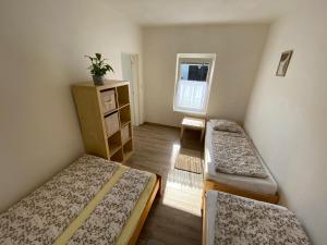 En eller flere senge i et værelse på Apartmán BENÍŠKOVEC, Suchdol nad Lužnicí