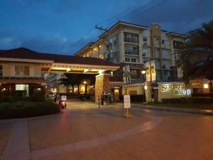 an empty street in front of a building at night at Amari Homestay @ Sorrento Oasis Condominium in Manila