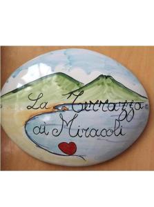 a rock with a picture of a mountain with a heart at La Terrazza ai Miracoli in Naples