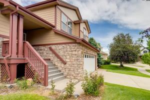 a house with a garage and a driveway at Spacious Aurora Home 20 Mi to Downtown Denver! in Aurora