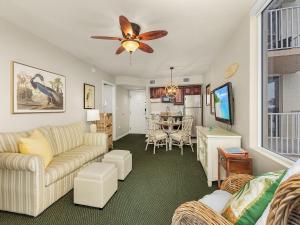 a living room with a couch and a table at Lovers Key Resort 503 - Fort Myers in Fort Myers Beach