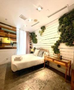 a bedroom with a bed and a table in it at Hotel Life Gran Via Design in Madrid