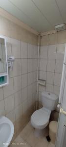 a small bathroom with a toilet and a sink at Δ1 in Dhidhimótikhon
