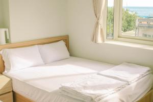Letto o letti in una camera di TETE Homestay