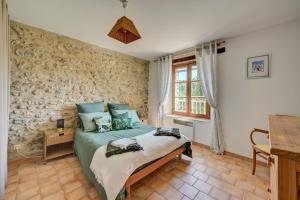 Ένα ή περισσότερα κρεβάτια σε δωμάτιο στο Domaine Bellavigne Gites et SPA +71 φωτογραφίες