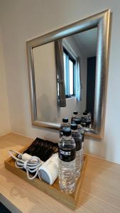 a table with bottles of water and a mirror at Hospitality Hotel in Xiaoliuqiu