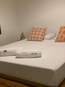 Uma cama ou camas num quarto em Vila Aratu Corumbau