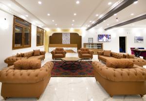 a large living room with couches and a table at Avulot Mountain Resort Hotel in Trabzon +45 photos