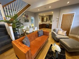 a living room with a couch and a table at Luxury 3-bed Victorian Townhouse Hosted by Hutch Lifestyle in Leamington Spa