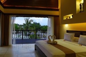Tempat tidur dalam kamar di Mala Garden Resort and Spa
