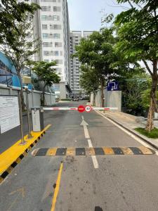 an empty street with a red car on the road at Ductaigallery's Apt& Pool-Good view in Ấp Phú Thọ