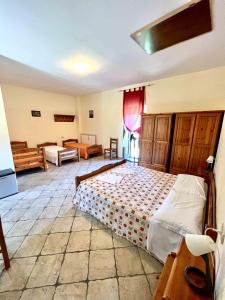 a bedroom with a large bed in a room at Affittacamere Porta Majella in San Valentino in Abruzzo Citeriore