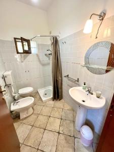 a bathroom with a toilet and a sink at Affittacamere Porta Majella in San Valentino in Abruzzo Citeriore