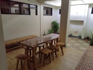 a large wooden table and chairs in a room at Mansion 8 Residences in Roxas City