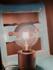 a light bulb sitting on top of a table at Camping Milk in Usmenieki