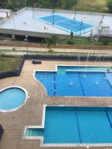 an overhead view of a pool with two swimming pools at Casa Lucy in Ibagué