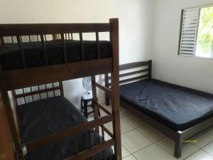 En eller flere senge i et værelse på CASA DE TEMPORADA + 28 billeder