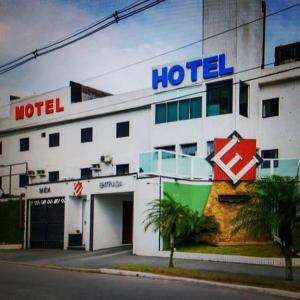 a hotel with a sign on the side of it at Hotel Extasy (Adult Only) in São Vicente
