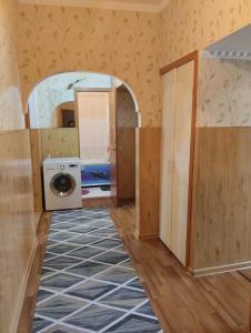 a laundry room with a washer and dryer at Karakol apartment in Karakol