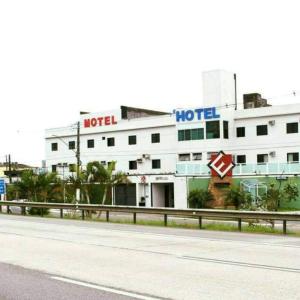 a hotel building on the side of a road at Hotel Extasy (Adult Only) in São Vicente