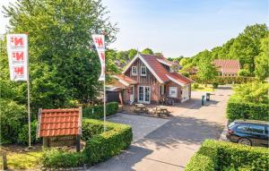 a house with two occupancy signs in front of it at Buitengoed Het Lageveld - 65 in Hoge-Hexel