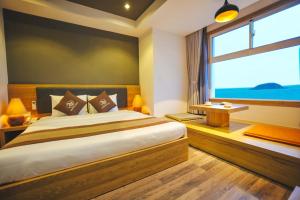 Postel nebo postele na pokoji v ubytování Seasing Boutique Hotel