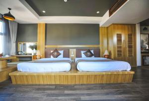 Postel nebo postele na pokoji v ubytování Seasing Boutique Hotel