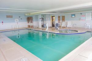 a large swimming pool in a hotel room at First Choice Inn at the Swell in Green River