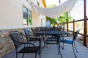 a row of tables and chairs on a patio at First Choice Inn at the Swell in Green River