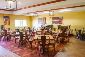 a dining room with tables and chairs in it at First Choice Inn at the Swell in Green River