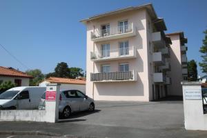 a white van parked in front of a building at La barthe in Biarritz