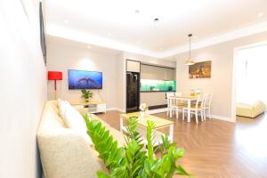 a living room with a couch and a table at Altara Apartment Quy Nhon in Quy Nhon